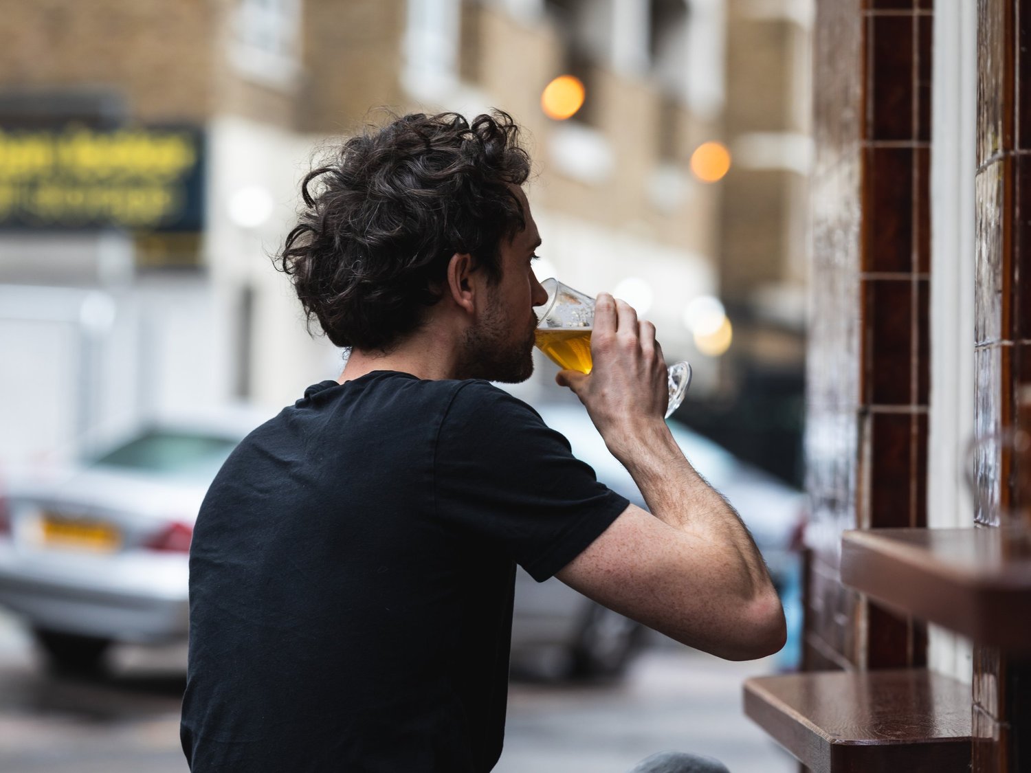 A pint drunk at the open window on Baldwin Street